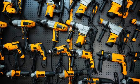 Many electric drills on the shelf